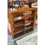 A golden oak Art Deco wall hanging bookshelf, architectural pediment,