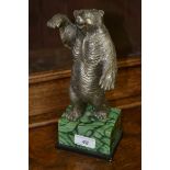 A 19th century Russian bear on faux malachite base