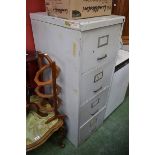 A military vintage four drawer filing cabinet.