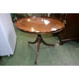 A reproduction mahogany tray top occasional table