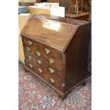 A George III mahogany bureau, fitted interior, two short drawers over three graduated long.