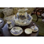 A Victorian five piece washstand set, comprising jug; bowl; brush pot; soap dish and flannel dish.