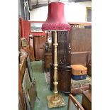A gilt standard lamp, turned fluted column.