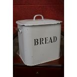 Kitchenalia-an early 20th century white enamel bread bin, a conforming milk pail, butter churn,