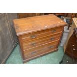 An Edwardian satinwood chest of drawers, moulded top over three graduated drawers,
