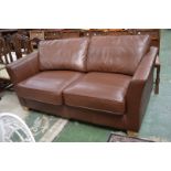 A modern designer two seat leather sofa