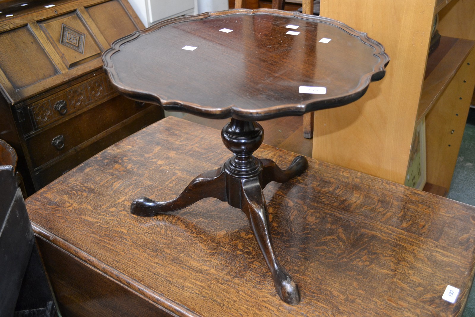 An oak tripod occasional table, piecrust circular top, fruitwood turned column, cabriole supports,