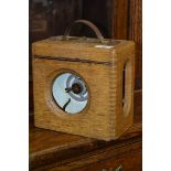 An oak cased Automatic Timing Clock Company pigeon clock