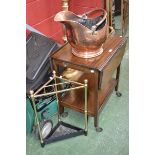 A mid 20th century mahogany tea trolley, a brass and cast iron corner stick stand,