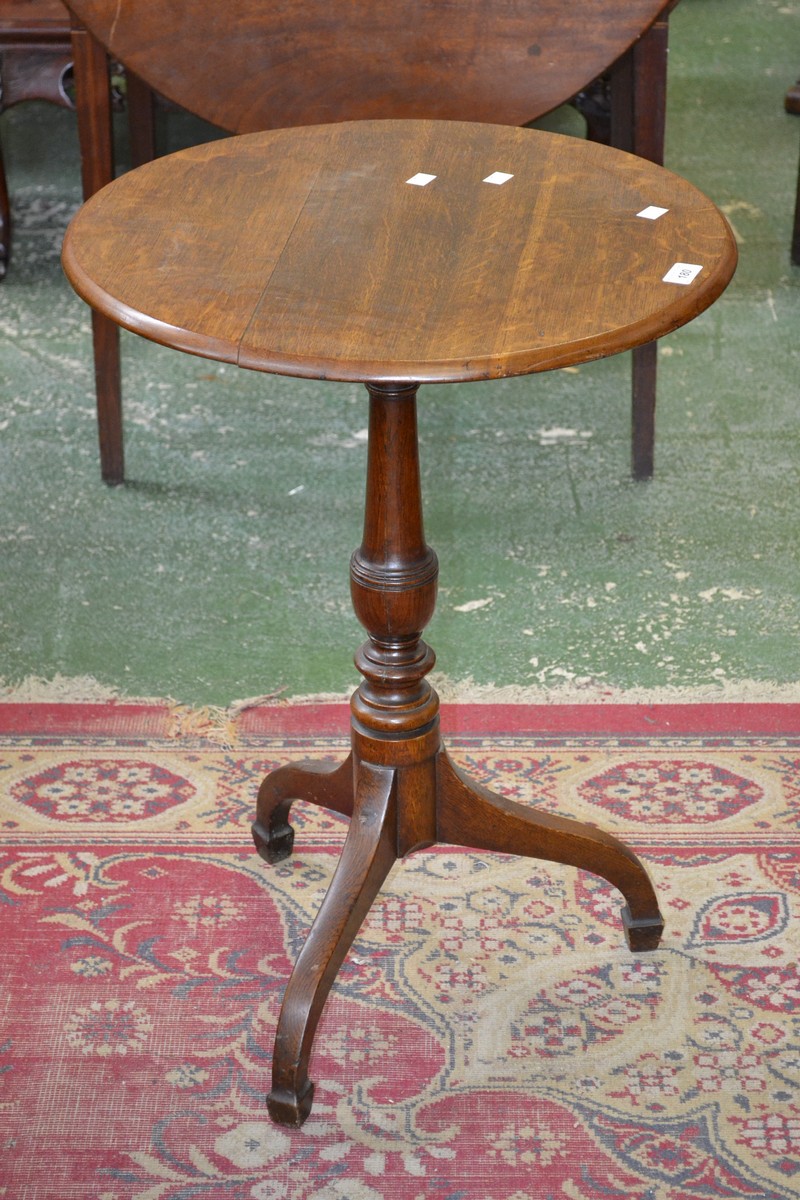 A 19th century oak tripod occasional table