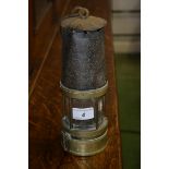 A 19th century brass and metal miners lamp