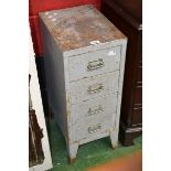 A small four drawer filing cabinet