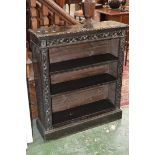 A floor standing oak bookcase, moulded top, adjustable shelving, plinth base,