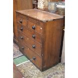 A late Victorian chest, oversailing top, blind fretworked frieze,