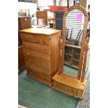 A contemporary pine chest of two short drawers over five long; a pine cheval mirror,