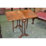 A Victorian walnut rounded rectangular Sutherland table, moulded top,