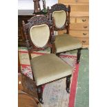 A pair of early 19th century dining chairs, carved top rail, turned, fluted and reeded uprights,