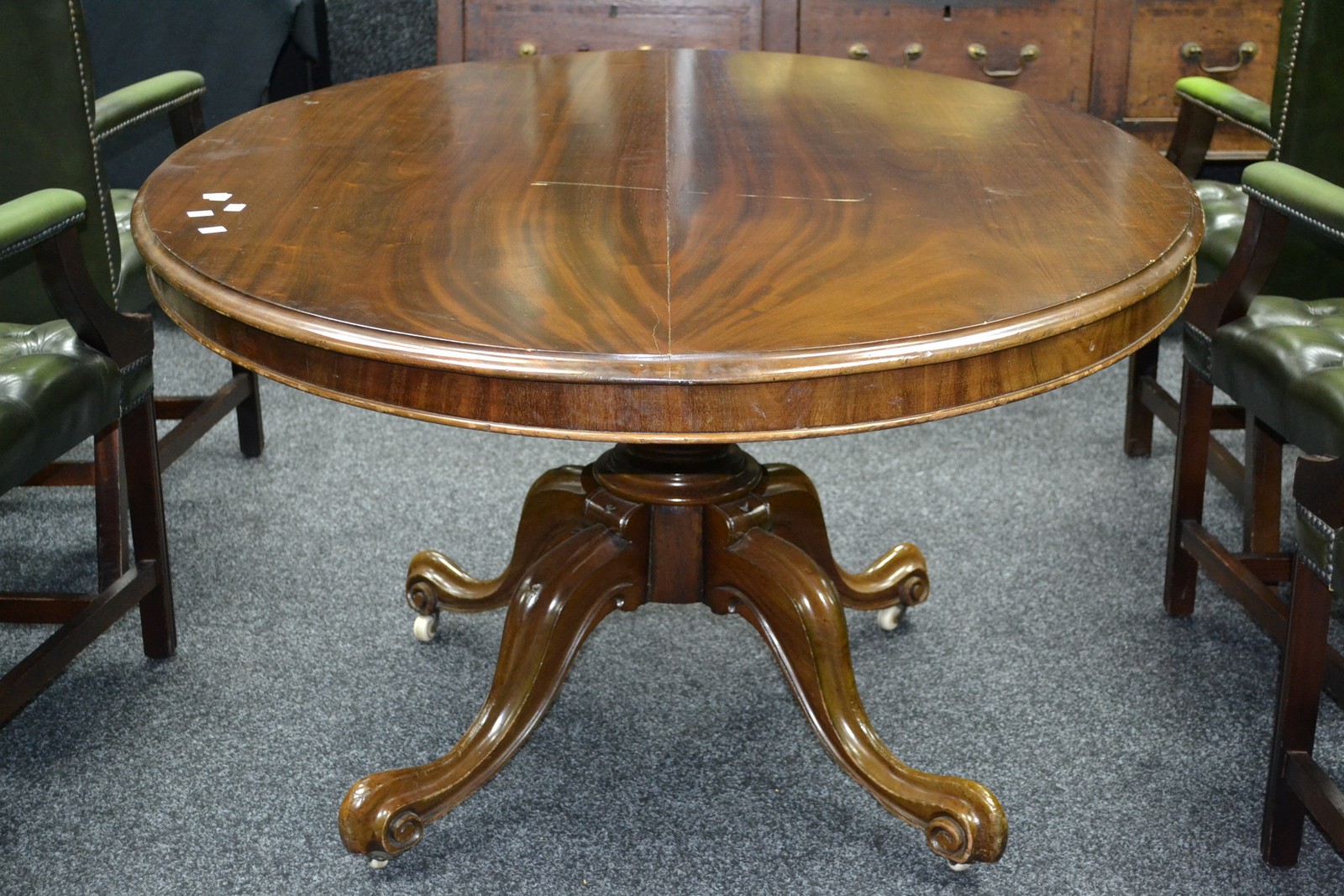 A Victorian mahogany tilt top table, oval top, cockbeaded frieze, compressed globular column,