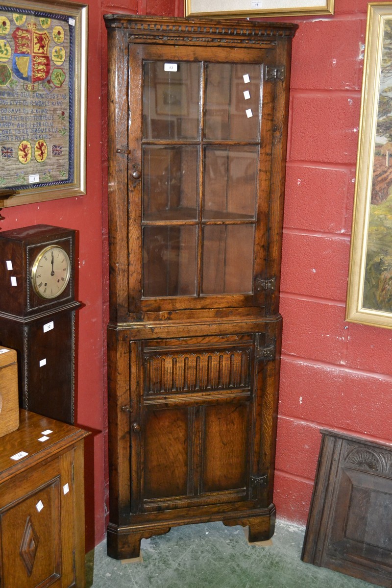 A Titchmarsh and Goodwin oak floor standing corner cupboard,