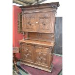 A French block fronted oak dresser, stepped cornice, shaped and carved frieze,