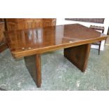 An Art Deco oak dining table, rounded rectangular crossbanded plank top, stadium supports,