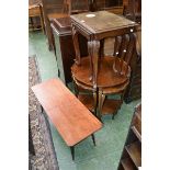 A mid 20th century nesto of three mahogany tables,