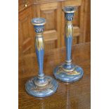 A pair of Chinoiserie blue lacquer candlesticks