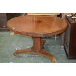 A mahogany loo table, circular top, spreading octagonal column, triform base,