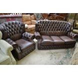 A contemporary three seat brown leather button upholstered sofa ;