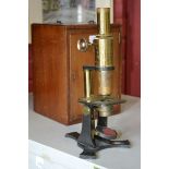 An Abraham & Co., Liverpool brass monocular microscope and mahogany case.