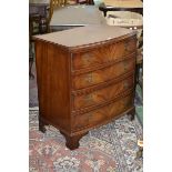 An 18th century style mahogany bow fronted chest of four long drawers, bracket feet,