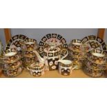 A Royal Crown Derby 2451 pattern tea service for twelve including tea pot, milk, sugar,