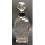 A silver mounted cut clear glass spirit decanter, star-cut stopper and base, 28.
