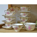 A Royal Crown Derby Pinxton Roses pattern tea service comprising, wavy edged plate,