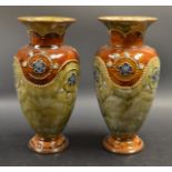 A pair of Royal Doulton stoneware ovoid vases, glazed in mottled shades of green and brown,