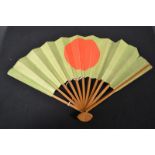 A Japanese WWII period eleven stick fan, issued by the Army Department under Hideki Tojo,