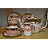 A Royal Crown Derby 2649 pattern tea service comprising teapot, two tea plates, four saucers,