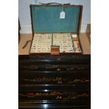An early 20th century bamboo and bone Mahjong set,