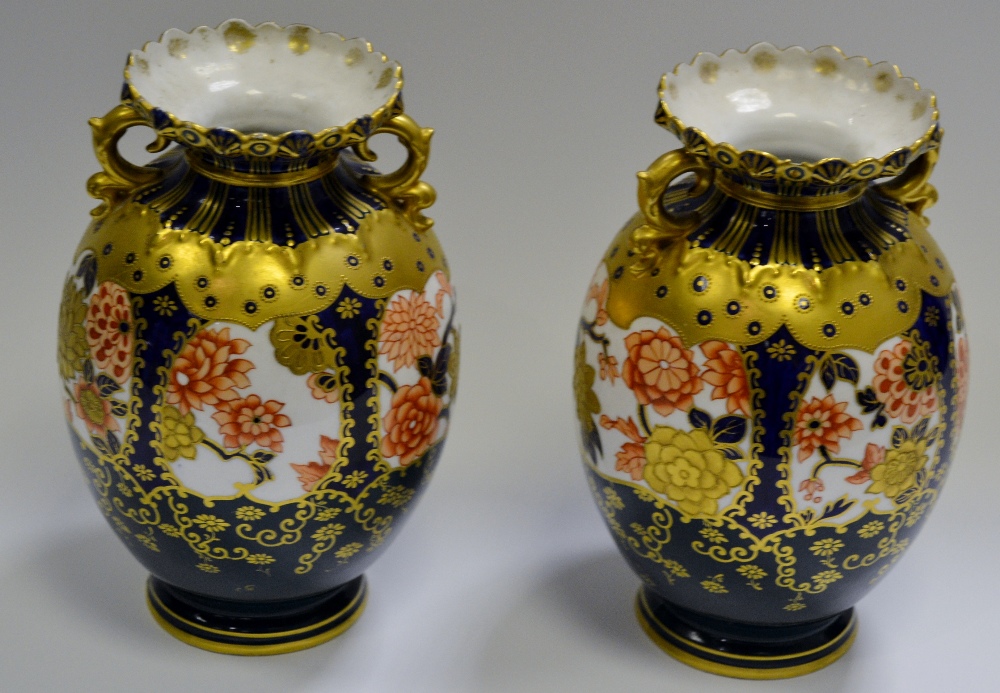 A pair of Royal Crown Derby 5704 pattern twin handled vases, printed marks,