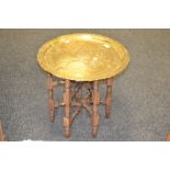 A Persian brass tray top occasional table