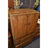 A mid 20th century veneered  cabinet ,