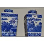 A pair of Ringtons tea caddy's printed with blue and white willow Pattern