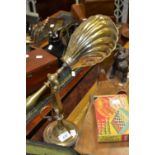 A brass desk lamp, shell shaped shade,