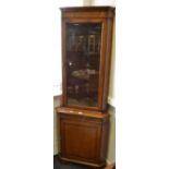 A 20th century corner unit, glazed top over single door,