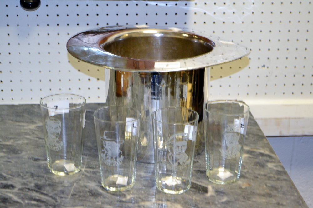 A white metal ice bucket in the form of a Top Hat;