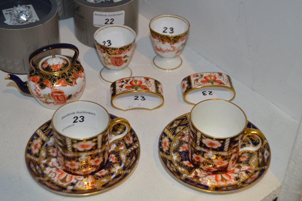 A Royal Crown Derby miniature 2649 pattern Teapot;  pair of egg cups;