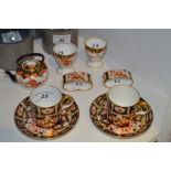 A Royal Crown Derby miniature 2649 pattern Teapot;  pair of egg cups;