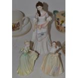 A Royal Doulton figure Lauren, HN 3872; a Coalport figure Spring Melody; a Coalport figure,