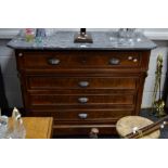 A French escritoire chest, marble top, canted angles, the top drawer opening to fitted interior,