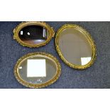 A gilt framed oval wall mirror,